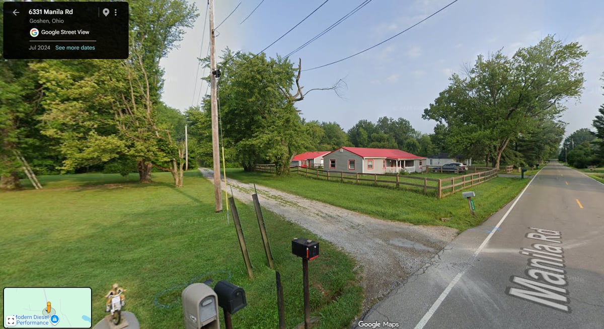 Satellite view of 6333 Manila Rd with pole barn and surrounding land